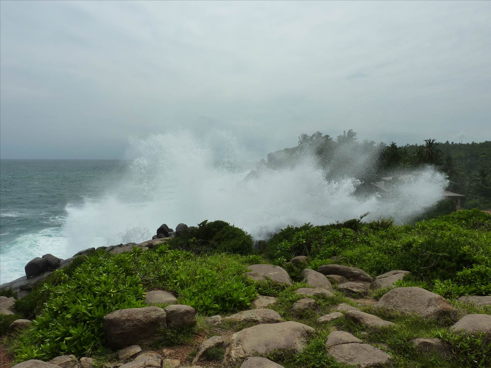 Swell breaking over hotel