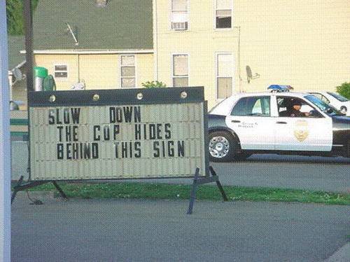copbehindsign