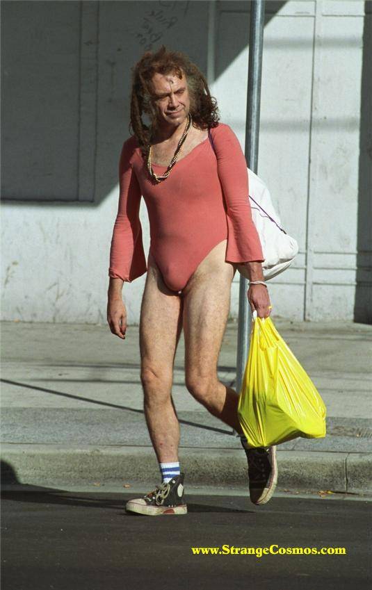 man-carrying-a-shopping-bag-and-wearing-a-weird-pi1