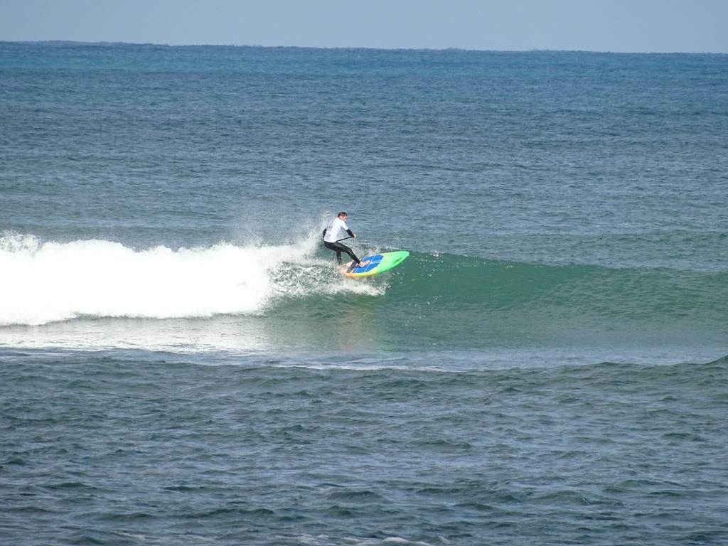Qld SUP surfing team members in action