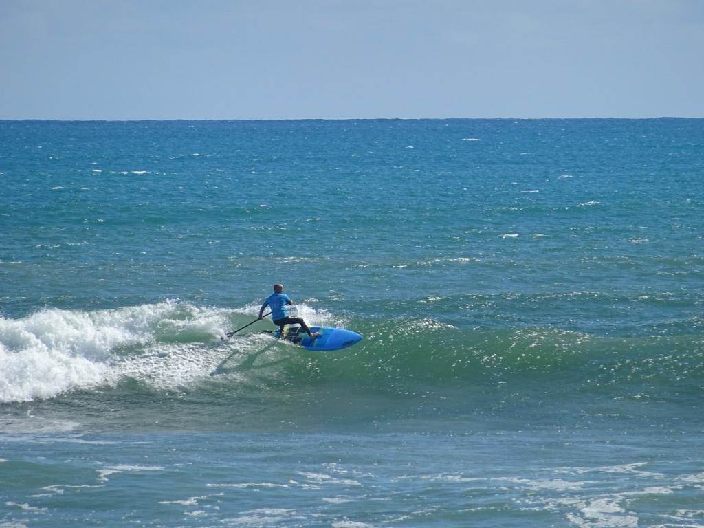 Qld SUP surfing team members in action