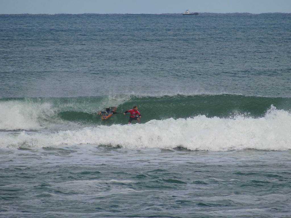 Qld SUP surfing team members in action