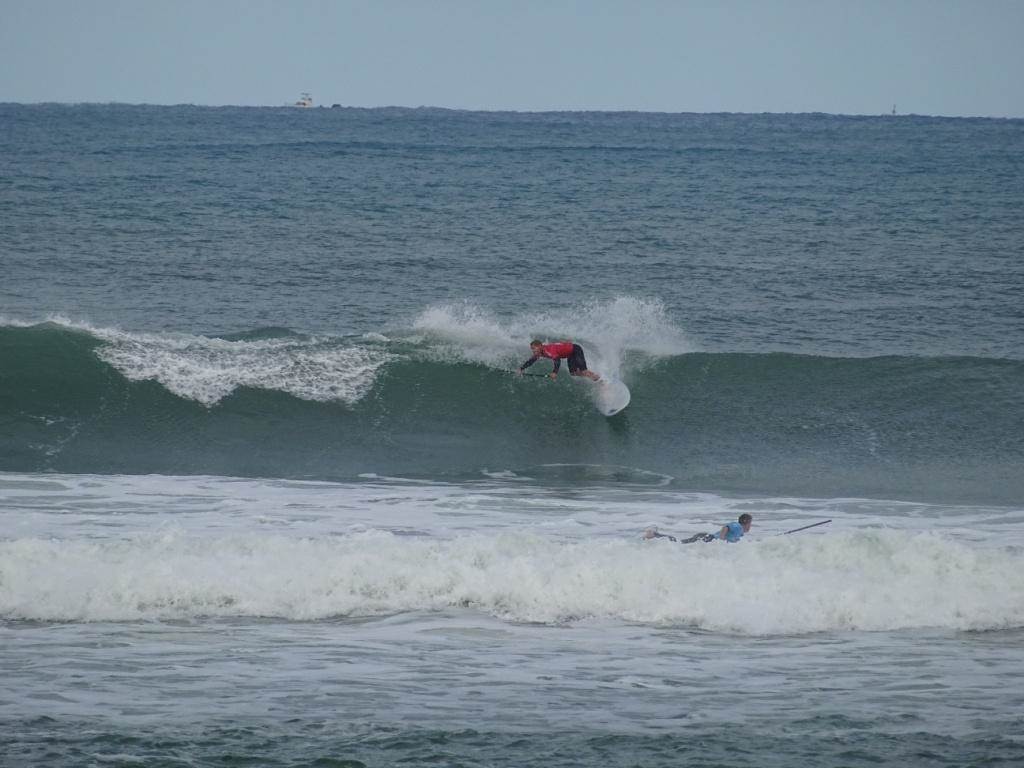 Qld SUP surfing team members in action