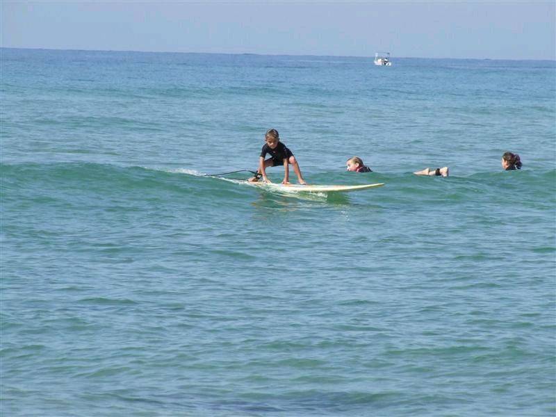Ebony (6 years) Having a surf on her new glass board.