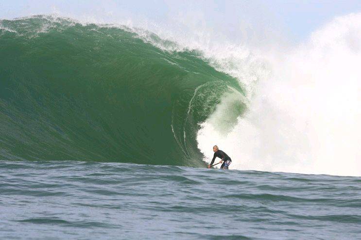 Jamie Mitchell charging on a SUP