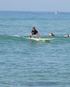 Ebony on her real board.  Not a foamie.