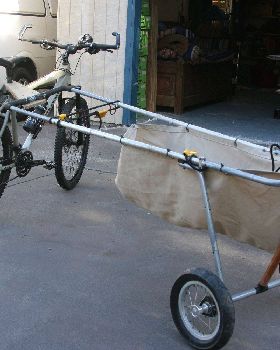 converted pram with  telescopic side arms....ali poles from camp shop......from kite to  sup.....