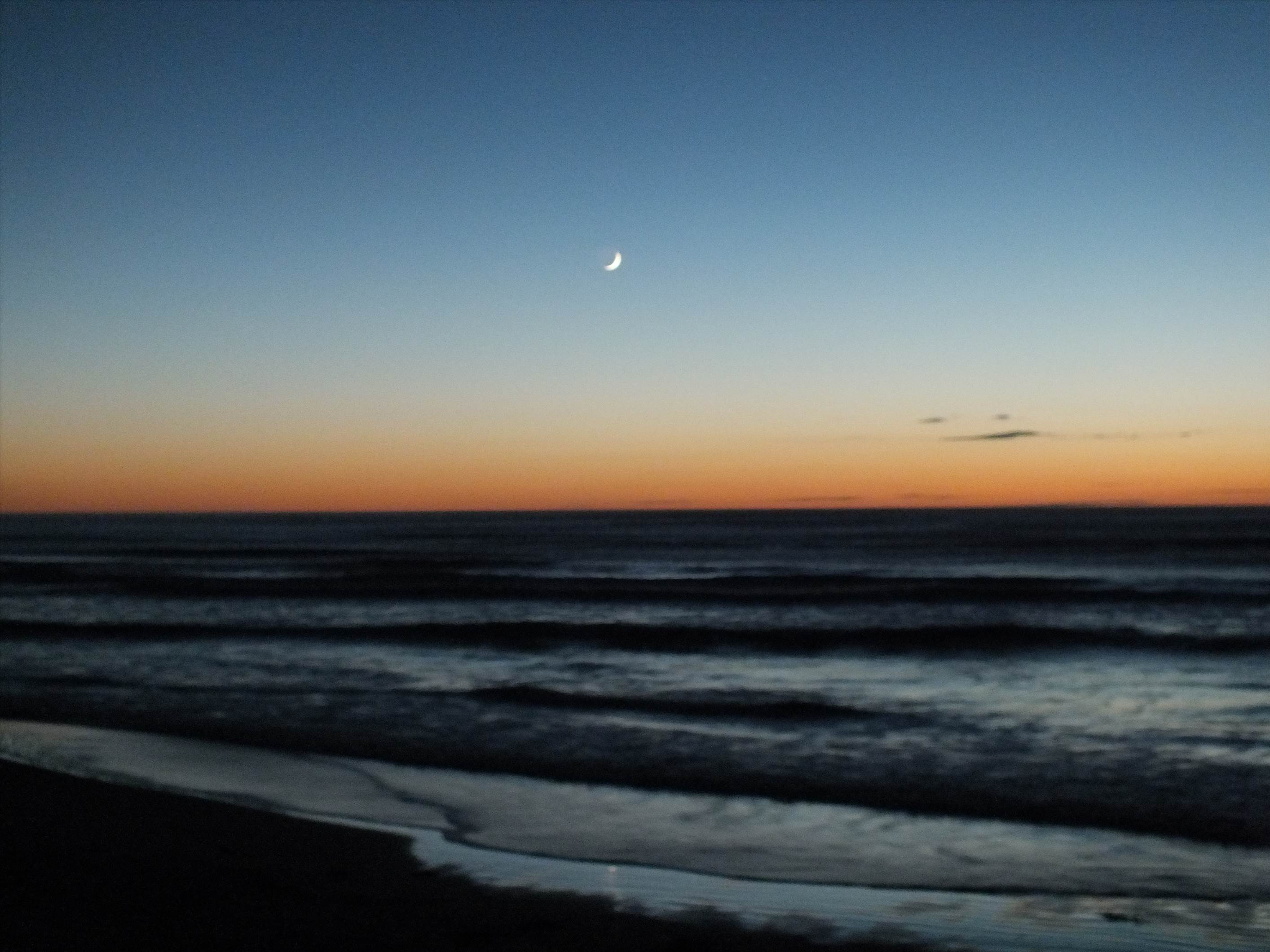 Crescent moon/sunrise over mak