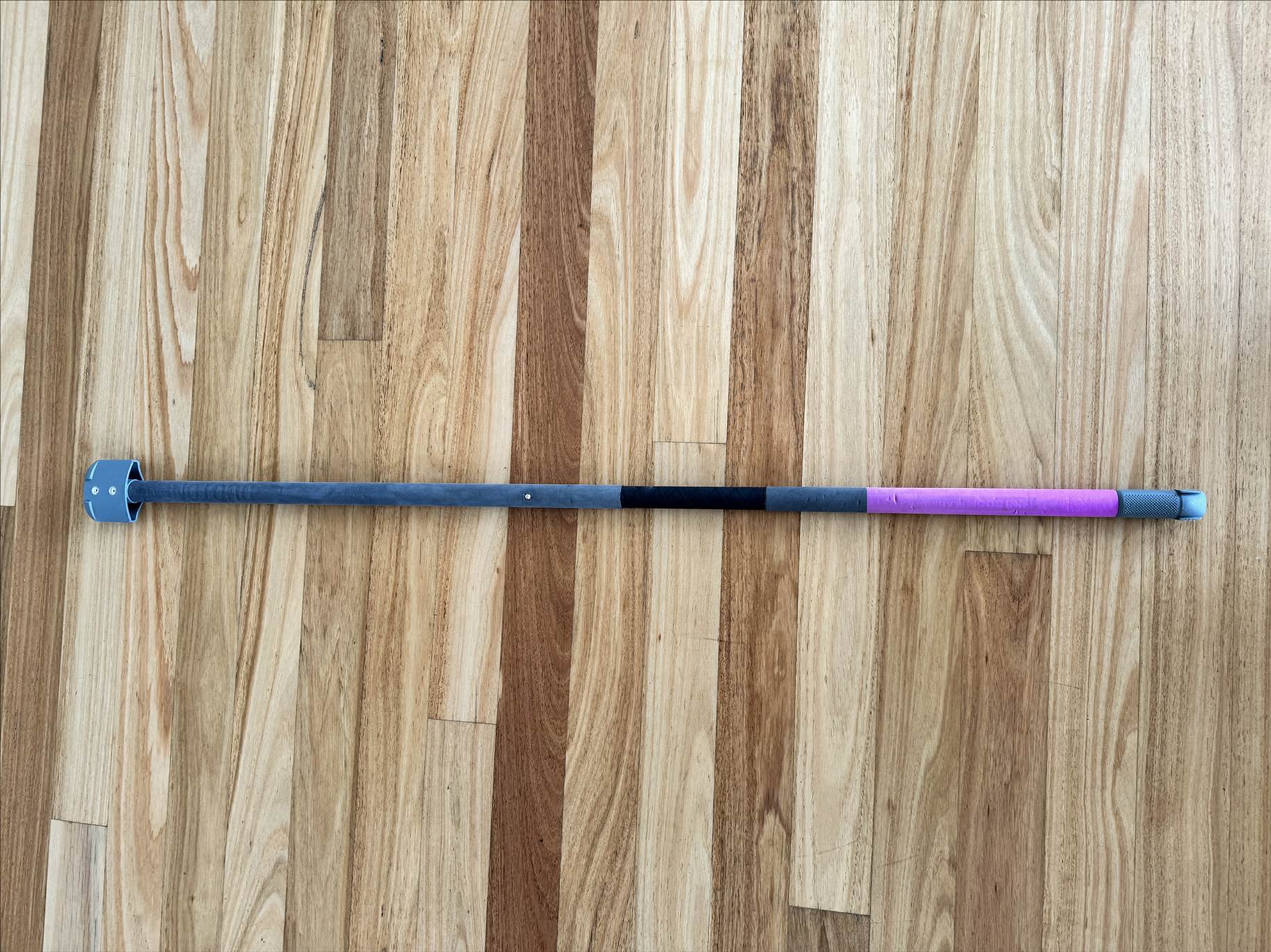 Two piece carbon boom for slick wing