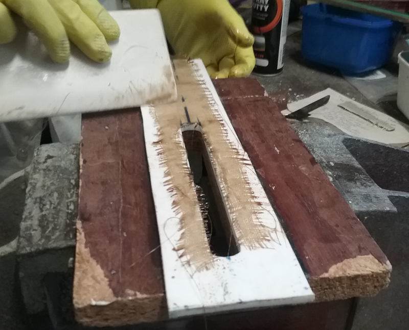 under cloth on jig