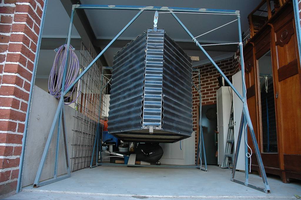 Windsurfing Trailer Box, suspended by lifting frames while trailer is on other duties