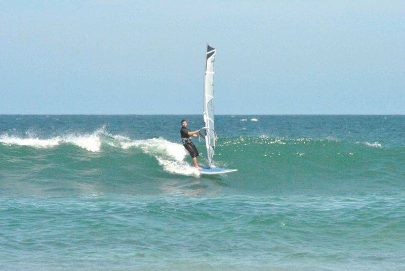 Getting some good waves and getting smashed on my SUP
