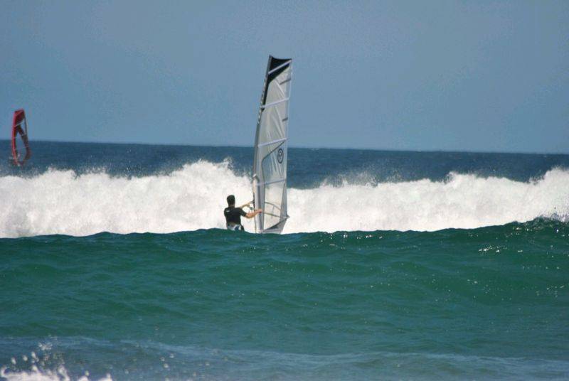 Getting some good waves and getting smashed on my SUP