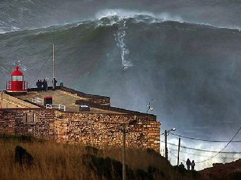 Surfers ride 140ft waves in Portugal - Surfing News